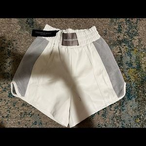 White leather shorts